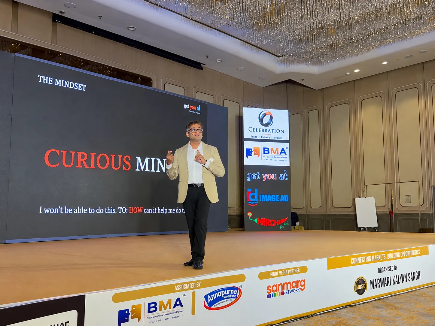 Ajay Binani speaking on stage